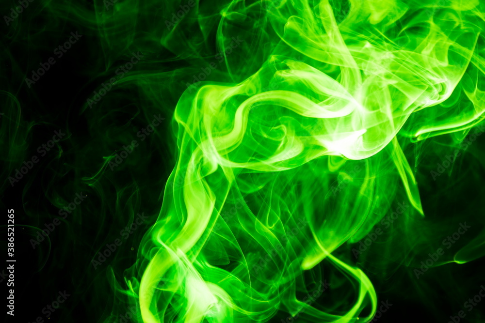 Green smoke on black background Green smoke on black background