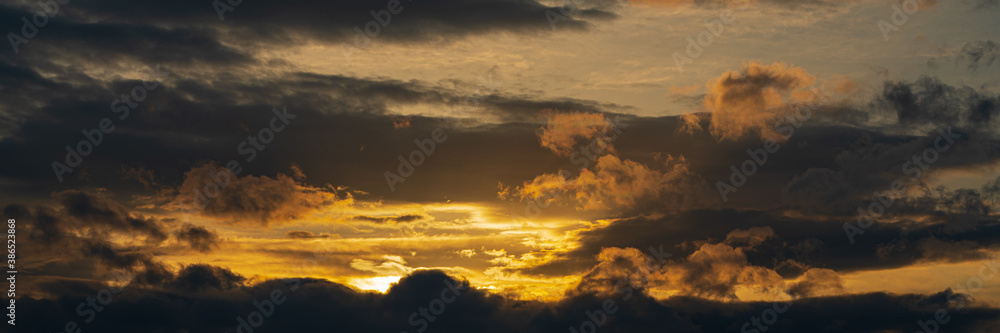 Panoramic view of dramatic clouds rising of sun floating in sky to change weather. Soft focus, motion blur sky majestic meteorology cloudscape.