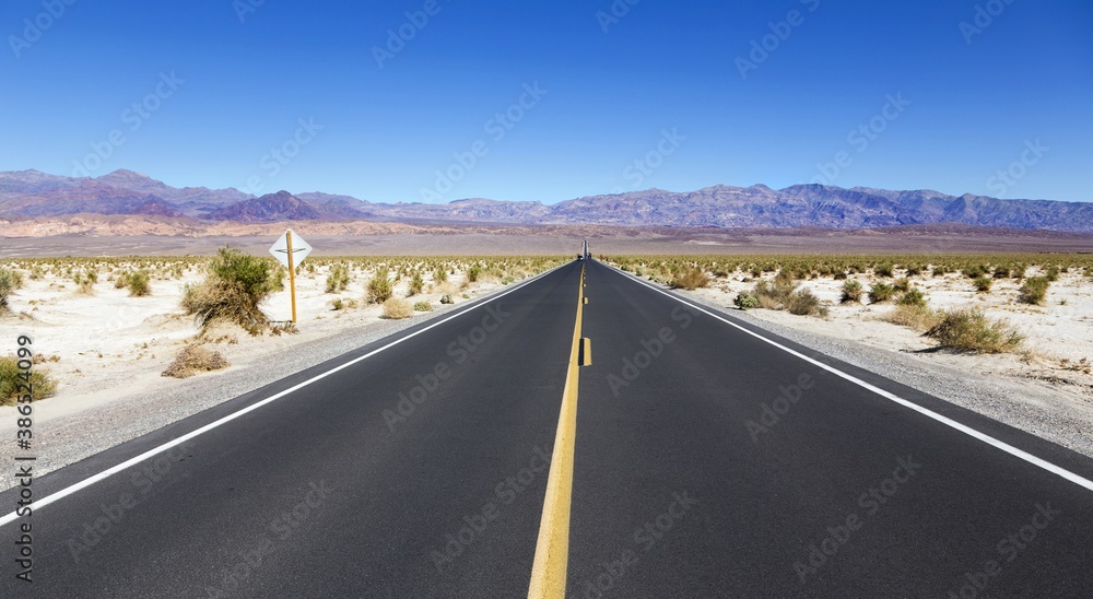 Driving Iconic State Highway 190 from Panamint Springs to Distant Mountains and Towne Pass in Death Valley National Park, California USA Driving Iconic State Highway 190 from Panamint Springs to Distant Mountains and Towne Pass in Death Valley National Park, California USA