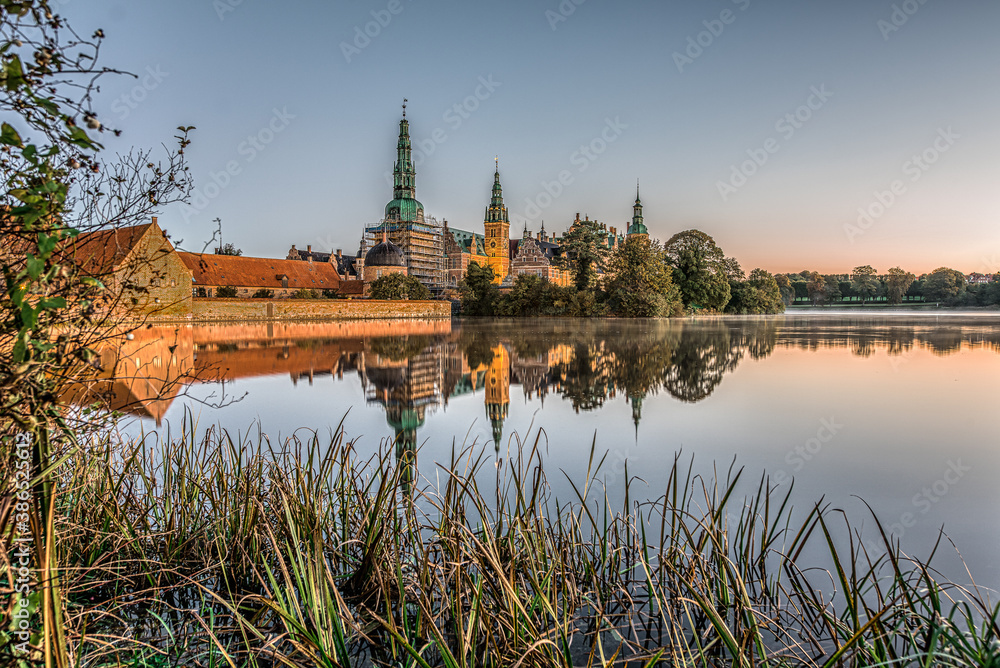 the vild lake of Frederiksborg with reeds and the castle in the background