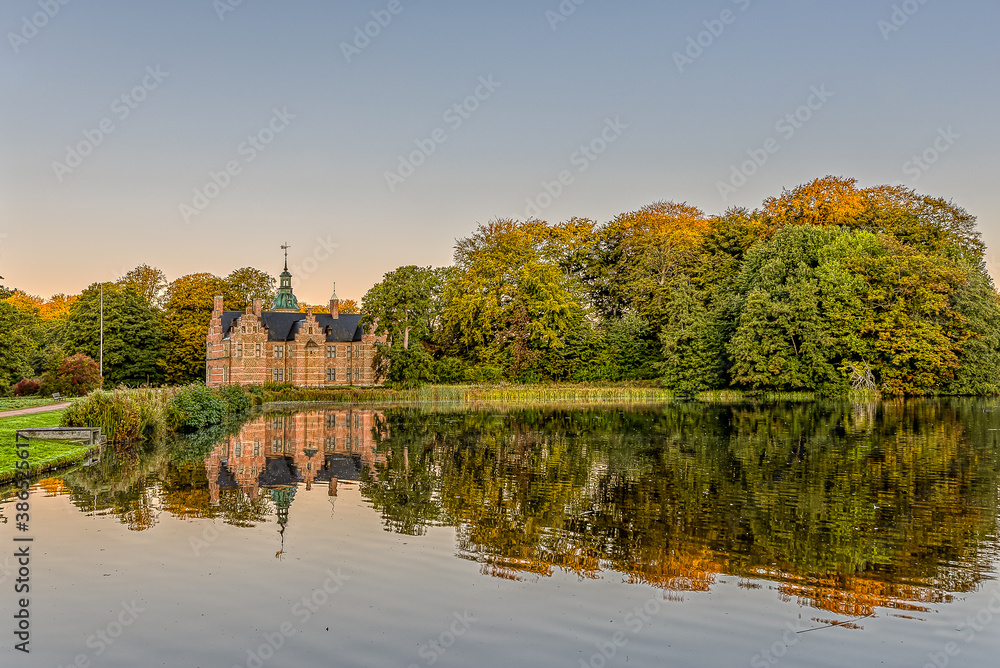 Frederiksborg Bath House Castle reflecting in the lake an early morning