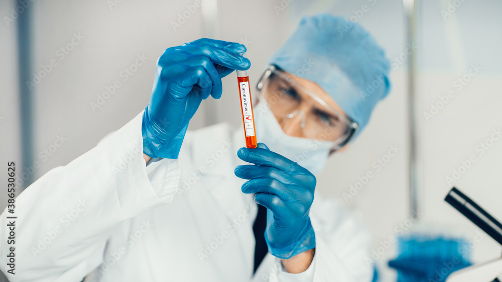 test tube in the hands of the researcher . test tube in the hands of the researcher .