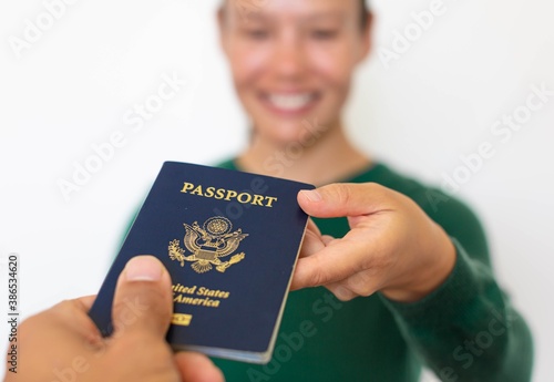 Fotografía American woman citizen receiving a US passport