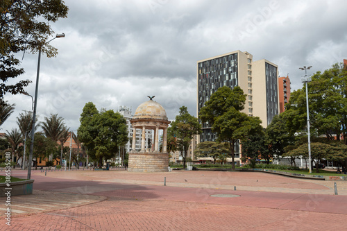BOGOTA, COLOMBIA -  Gabriel Garcia Marquez Journalist park with simon bolivar temple and office buildings at downtown sunny day photo