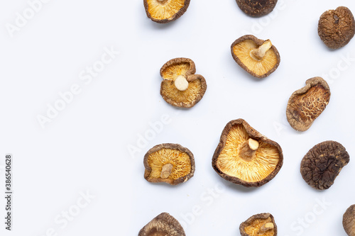 Dried shiitake mushrooms on white background.