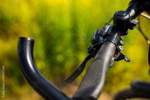 Bicycle handlebar close-up on a green background