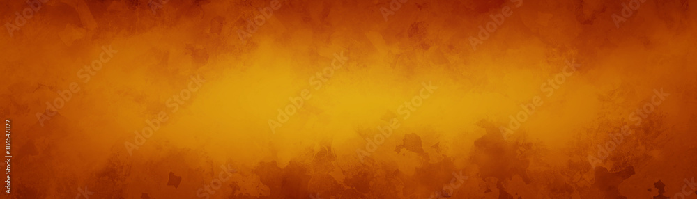 fall or autumn background concept with abstract mottled leave pattern painted in grunge texture design, hot red yellow and orange colors for halloween and thanksgiving designs
