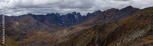 Panoramic View of Scenic Landscape and Mountains on a Cloudy Fall Day in Canadian Nature. Taken in Tombstone Territorial Park, Yukon, Canada.