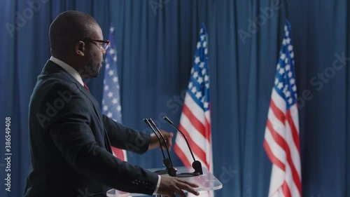 Wallpaper Mural Side view shot footage of African American man running for presidency speaking about reforms while debating Torontodigital.ca