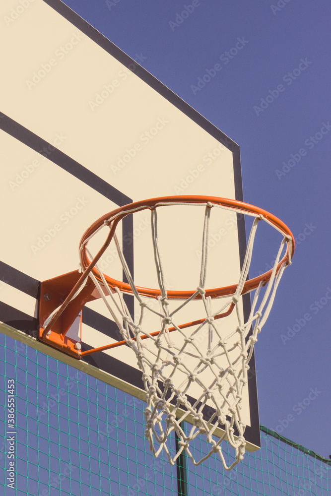 Basketball board with basket hoop on playground. Sport, recreation and healthy lifestyles on fresh air