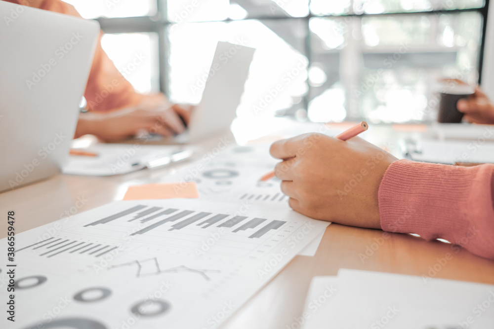 Business people analyzing investment graph meeting brainstorming and discussing plan in meeting room, investment concept Business people analyzing investment graph meeting brainstorming and discussing plan in meeting room, investment concept