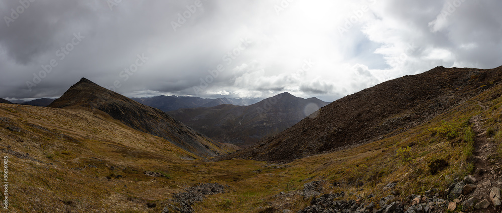 Panoramic View of Scenic Landscape, Valley and Mountains on a Cloudy Fall Day in Canadian Nature. Taken in Tombstone Territorial Park, Yukon, Canada.