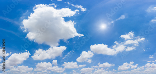 Blue sky and clouds with sun and daylight natural background.