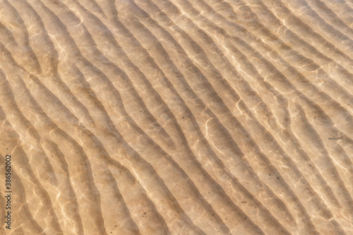 Sandy seabed pattern under shallow water photo