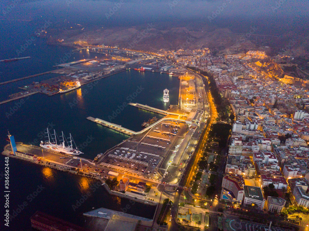 Fototapeta premium Panoramic view of coastline and city in Almeria on dusk, Spain