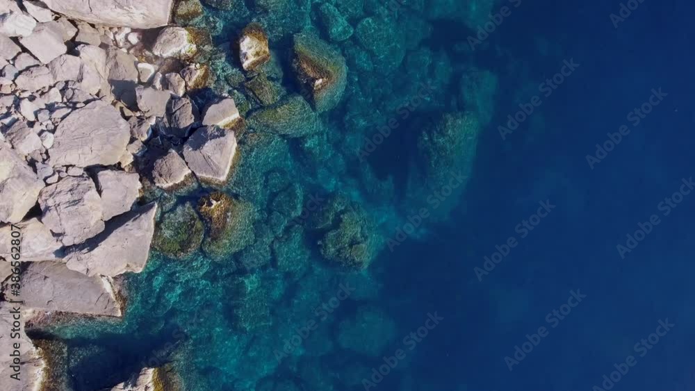 4k top down shot of rocks in clear turquoise water - Mediterranean Sea West-coast - Cristal clear ocean - Clean water 4k top down shot of rocks in clear turquoise water - Mediterranean Sea West-coast - Cristal clear ocean - Clean water