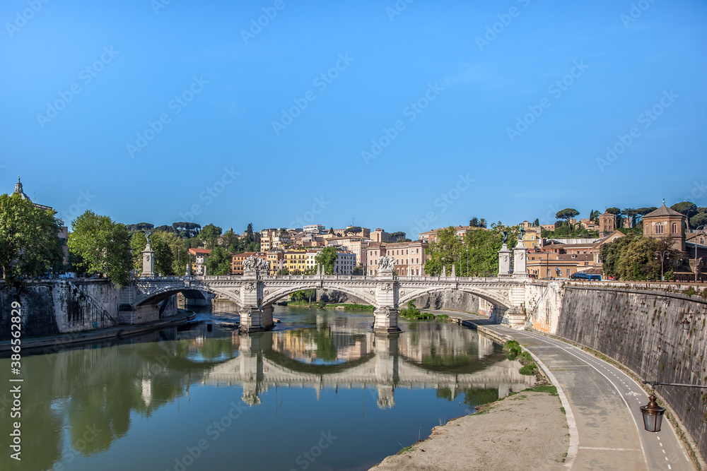 The banks of the river Tiber and Ponte Vittorio Emanuele in Rome. Lazio, Italy