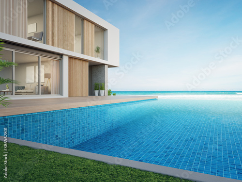 Empty outdoor wooden floor terrace near swimming pool and green grass garden in modern beach house or luxury villa. Building exterior 3d rendering with sea view.