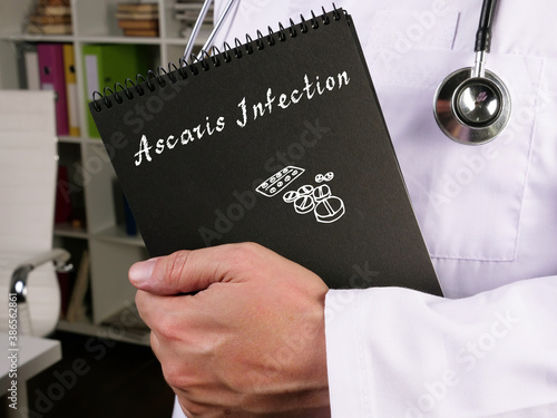 Health care concept about Ascaris Infection with inscription on the piece of paper.