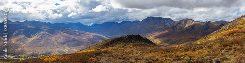 Panoramic View of Scenic Mountains and Valley from Above on A Beautiful Fall Day in Canadian Nature. Aerial Shot. Taken in Tombstone Territorial Park, Yukon, Canada.