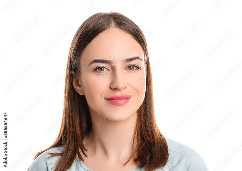 Young woman with marking for eyebrow correction against white background Young woman with marking for eyebrow correction against white background