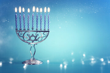Religion image of jewish holiday Hanukkah background with menorah (traditional candelabra) and candles