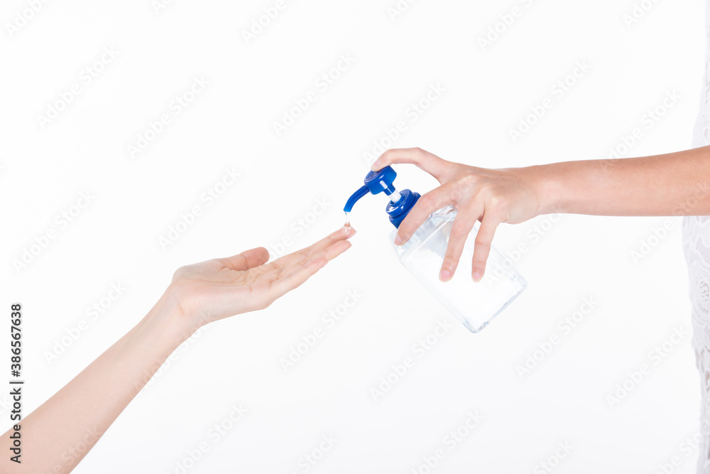 woman hand held Sanitizer dispenser Alcohol 70% Gel pump bottle