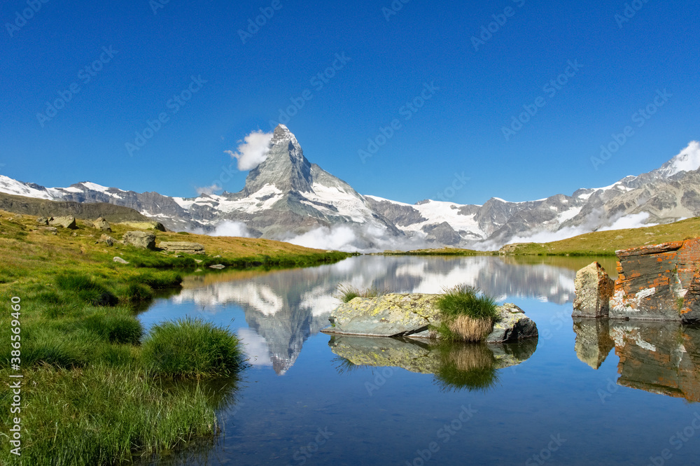 Beautiful Swiss Alps landscape with Stellisee lake and Matterhorn mountain reflection in water, summer mountains view, Zermatt, Switzerland
