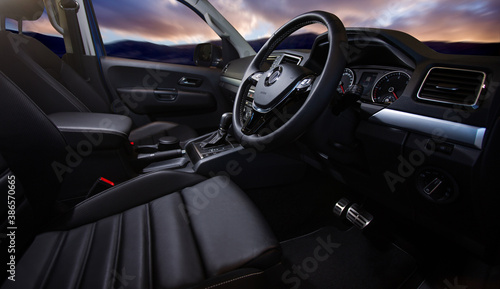 Luxury car interior. Steering wheel, shift lever and dashboard. © Кристина Пахомова