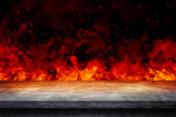 Side view of Empty concrete table top with orange fire or flame and sparkles in dark room.