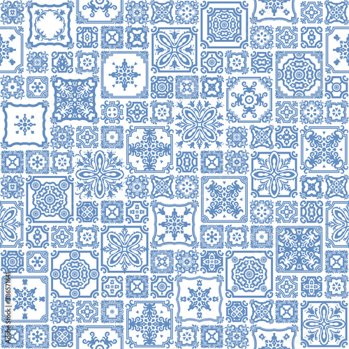 Seamless patchwork pattern of blue painted mosaic tiles with geometrical and floral ornaments in Dutch majolica ceramic style. Wallpaper décor, batik print, surface map, wrapping paper