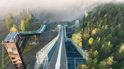 Ski jump slope, aerial view of the jumping tower photo