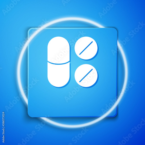 White Toothache painkiller tablet icon isolated on blue background. Tooth care medicine. Capsule pill and drug. Pharmacy design. Blue square button. Vector.