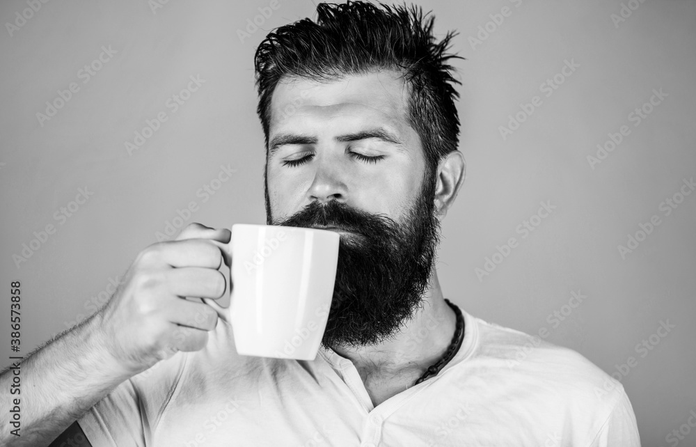 Good morning, man holding a cup tea. Morning concept. Handsome bearded male holds cup of coffee, tea. Black and white Good morning, man holding a cup tea. Morning concept. Handsome bearded male holds cup of coffee, tea. Black and white