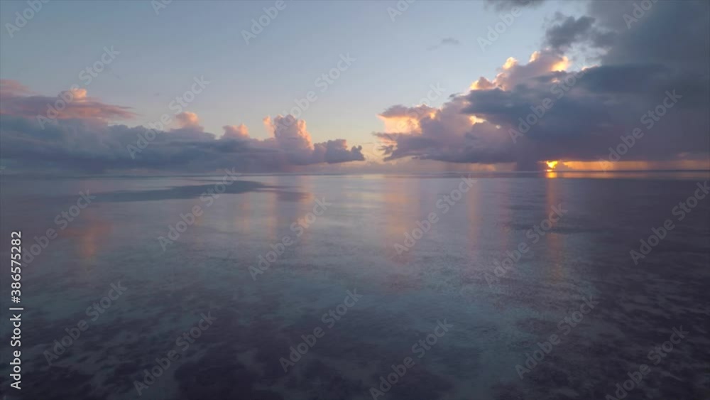 Tahiti - Unbelievable Sunset Landscape over Tropical Ocean Waters - Aerial Drone View Tahiti - Unbelievable Sunset Landscape over Tropical Ocean Waters - Aerial Drone View