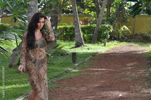 Portrait of red haired young women with nose rings laughing in garden