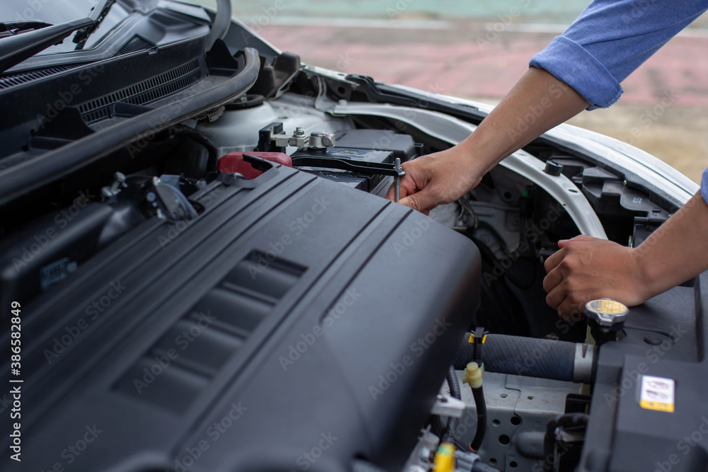 Man's hand is investigating the reason why his car crashed, car insurance concept. Man's hand is investigating the reason why his car crashed, car insurance concept.