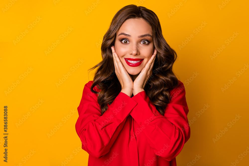 Photo of attractive funky lady hold hands on cheeks toothy smiling crazy facial expression unbelievable good news wear red office shirt isolated bright yellow color background Photo of attractive funky lady hold hands on cheeks toothy smiling crazy facial expression unbelievable good news wear red office shirt isolated bright yellow color background