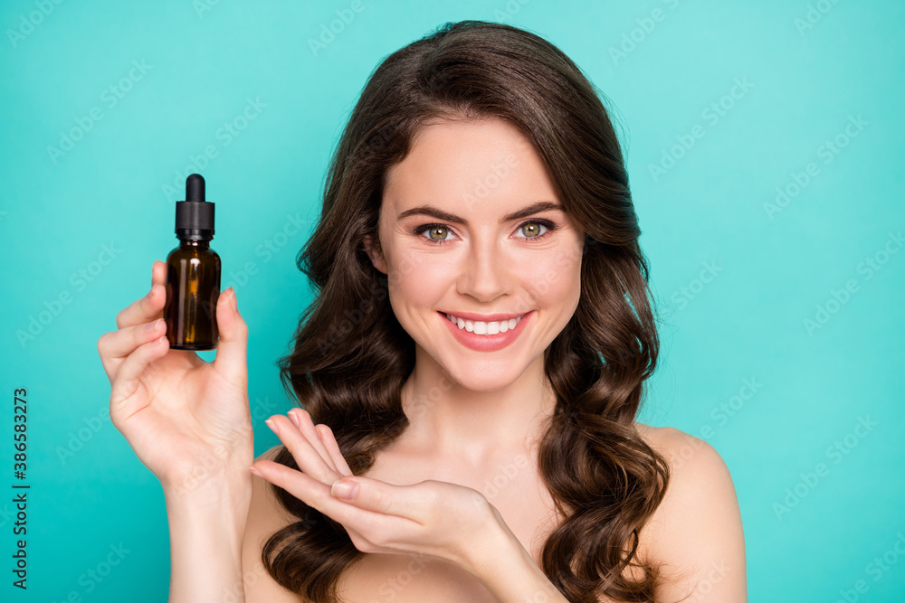 Closeup photo of beautiful naked lady wavy long hairdo hold professional cure serum bottle oil treatment cosmetologist specialist advising buy product isolated teal color background Closeup photo of beautiful naked lady wavy long hairdo hold professional cure serum bottle oil treatment cosmetologist specialist advising buy product isolated teal color background