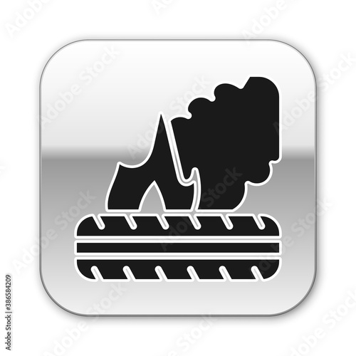Black Lying burning tires icon isolated on white background. Silver square button. Vector.
