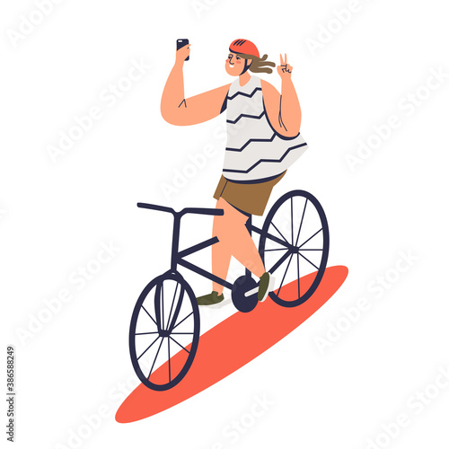 Girl making selfie photo riding bicycle. Dangerous selfie photo taking concept