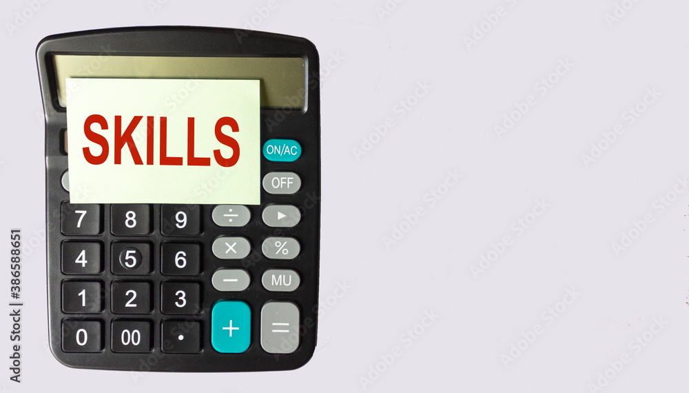 Skills written on a sticker on the calculator. Space for writing, white background Skills written on a sticker on the calculator. Space for writing, white background