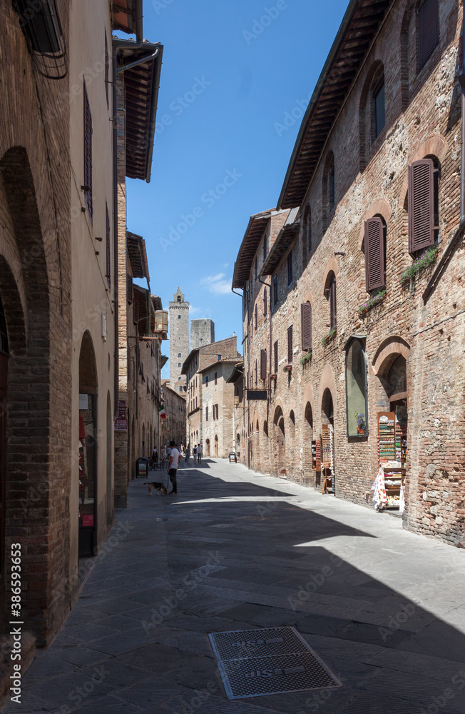 street in the town of San Gimignano with its towers during the lockdown for COVID-19