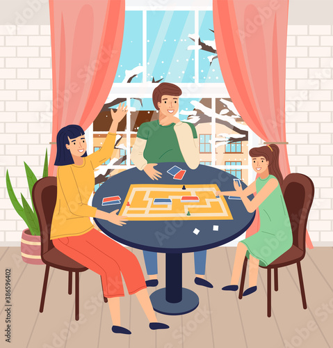 Happy family spend time at home. People playing in table game with cards, labyrinth. Mother, father and daughter play together. Indoors home activity, hobby. Cold snowy winter outside the window