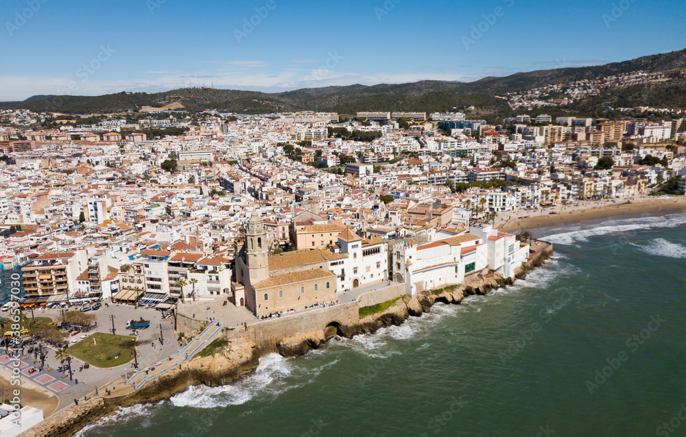 Panorama of coastal city of Sitges with building of Monastery, Barcelona, Spain