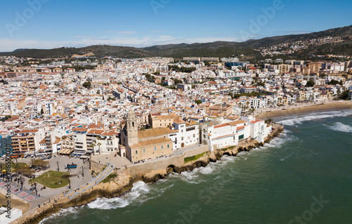 Fototapeta Naklejka Na Ścianę i Meble -  Panorama of coastal city of Sitges with building of Monastery, Barcelona, Spain