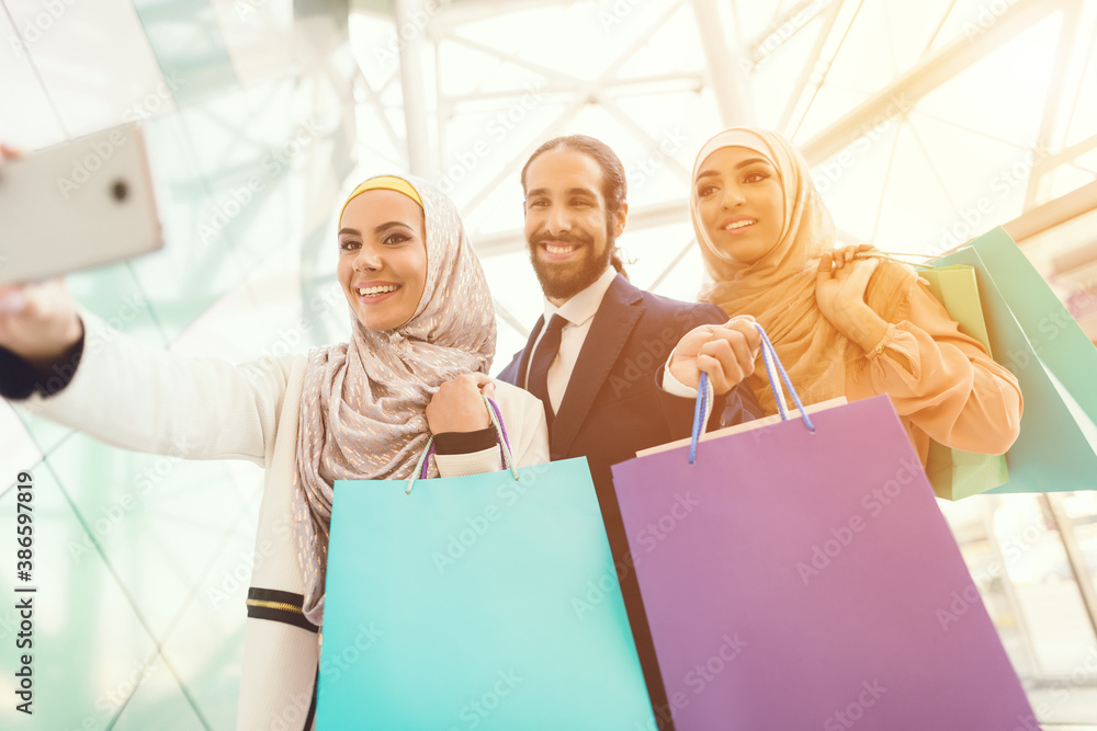 Young Arabian People Shopping in Modern Mall. Young Arabian People Shopping in Modern Mall.