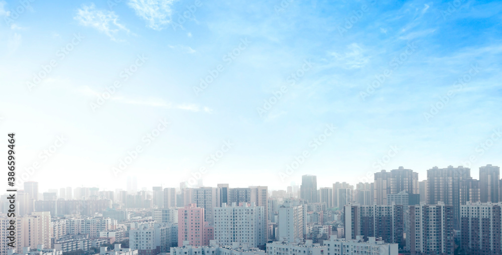 World Cities Day concept:  real estate modern city urban skyline under blue sky 