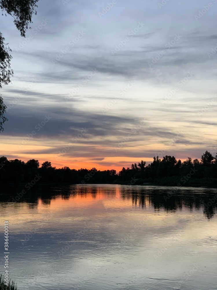 Fototapeta premium sunset over the river