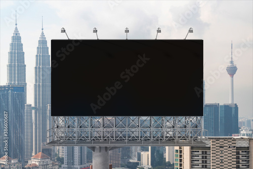Canvas Print Blank black road billboard with Kuala Lumpur cityscape background at day time